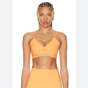 Le Ore Bandier Revolve Trevi Twist Front Sports Bra Size Large NWT